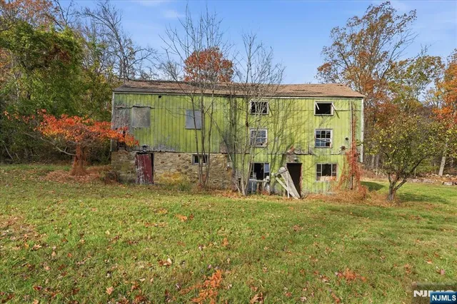 a view of a park with iron fence