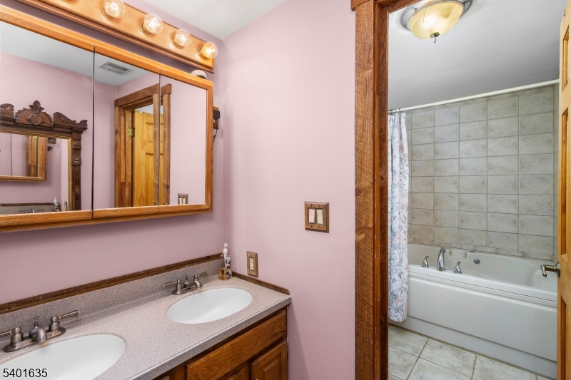 37 Ward Road Blairstown, NJ 07825 - Photo 17 of 28 a bathroom with a sink and a mirror