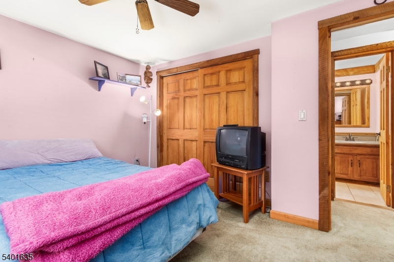 37 Ward Road Blairstown, NJ 07825 - Photo 18 of 28 a bedroom with a bed and wooden floor
