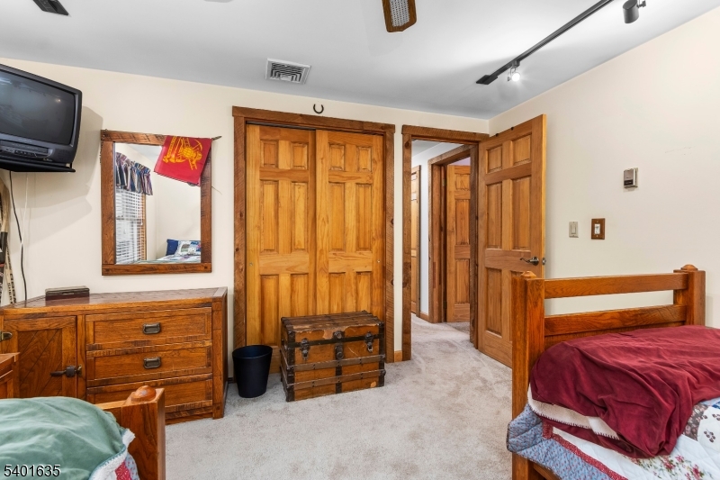 37 Ward Road Blairstown, NJ 07825 - Photo 21 of 28 a bedroom with a bed and a tv