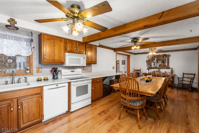 37 Ward Road Blairstown, NJ 07825 - Photo 7 of 28 a kitchen with a dining table chairs sink and stove