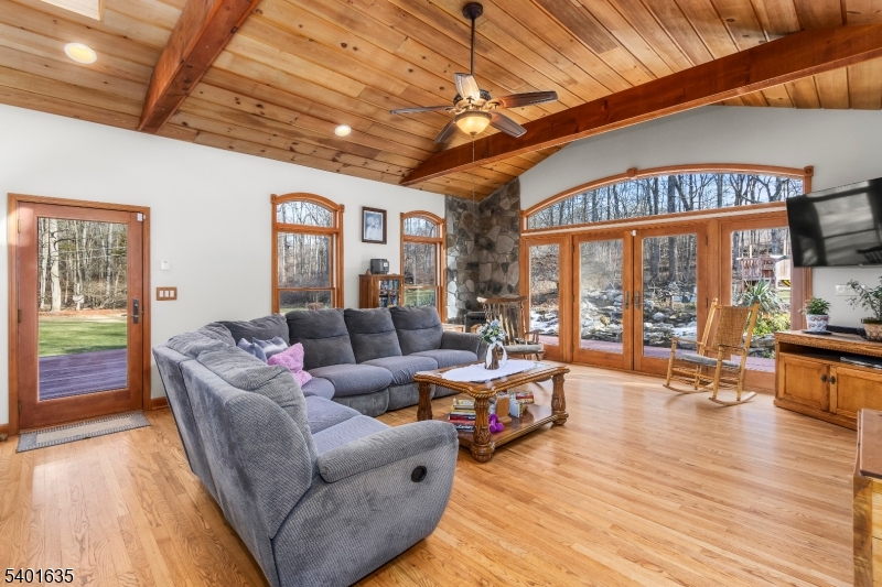 37 Ward Road Blairstown, NJ 07825 - Photo 10 of 28 a living room with furniture a wooden floor and a large window