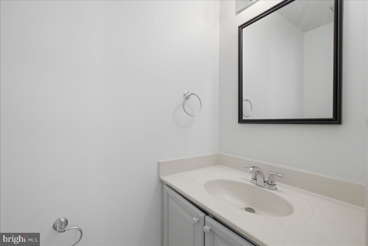 8902 Winding Hollow Way Springfield, VA 22152 - Photo 13 of 34 Clean powder room with updated feel.