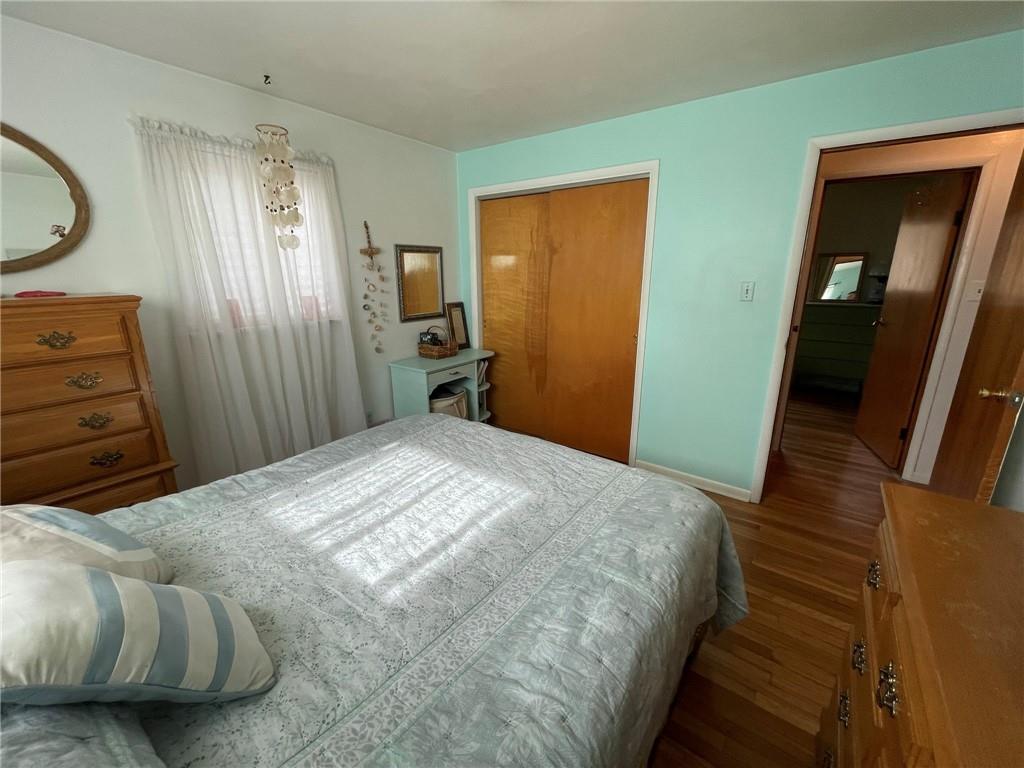 63 Locust Street McKees Rocks, PA 15136 - Photo 11 of 25 a bedroom with a bed and a mirror