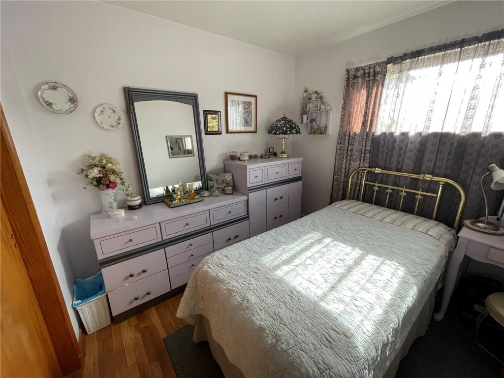 63 Locust Street McKees Rocks, PA 15136 - Photo 12 of 25 a bedroom with a bed and a dresser