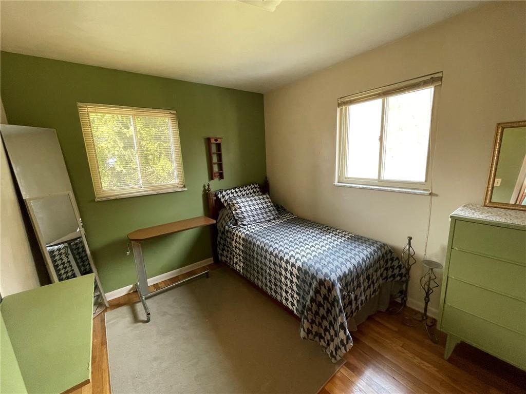63 Locust Street McKees Rocks, PA 15136 - Photo 13 of 25 a bedroom with a bed and a window