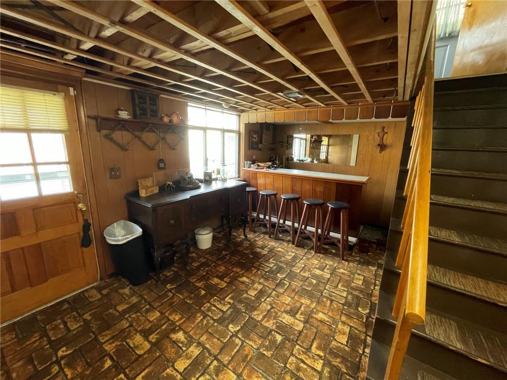 63 Locust Street McKees Rocks, PA 15136 - Photo 18 of 25 a view of an empty room with wooden floor and furniture