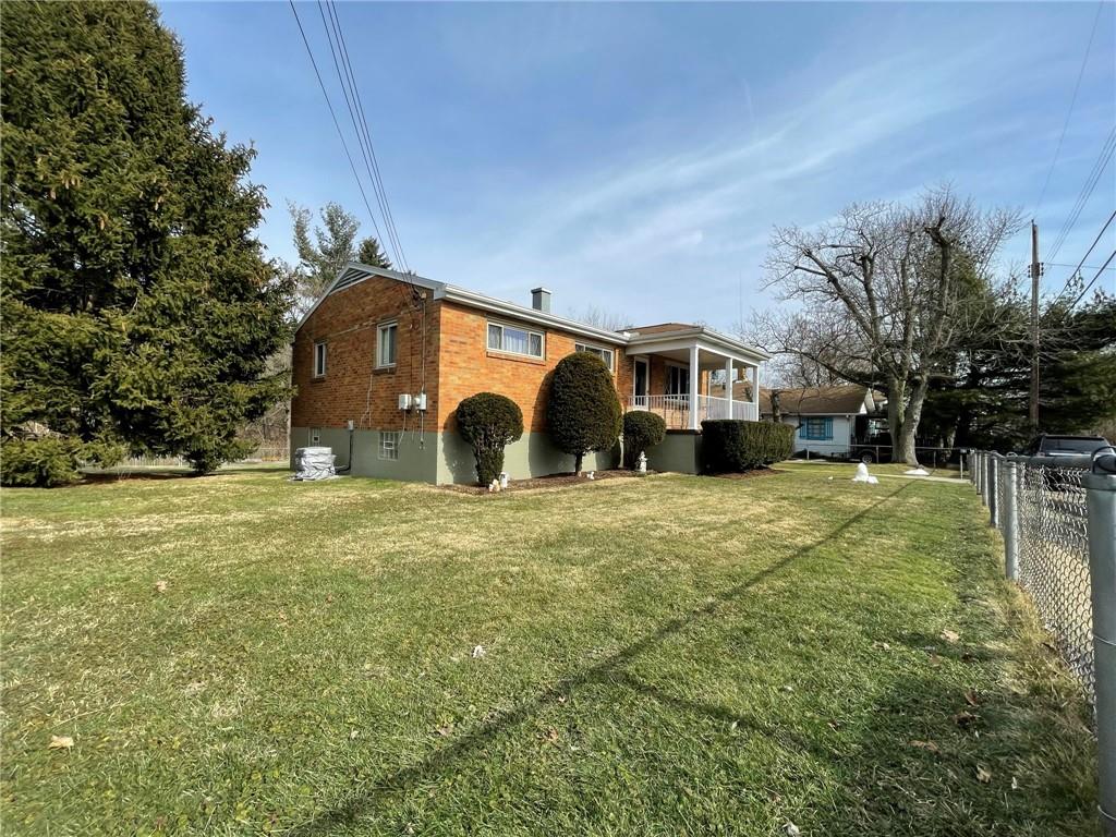 63 Locust Street McKees Rocks, PA 15136 - Photo 2 of 25 a front view of house with yard