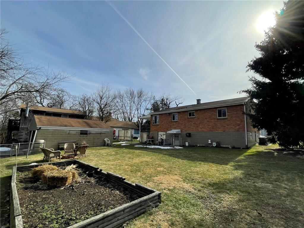 63 Locust Street McKees Rocks, PA 15136 - Photo 24 of 25 a view of a backyard with open kitchen