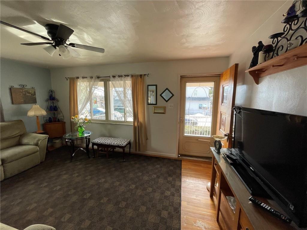 63 Locust Street McKees Rocks, PA 15136 - Photo 4 of 25 a living room with furniture and a flat screen tv