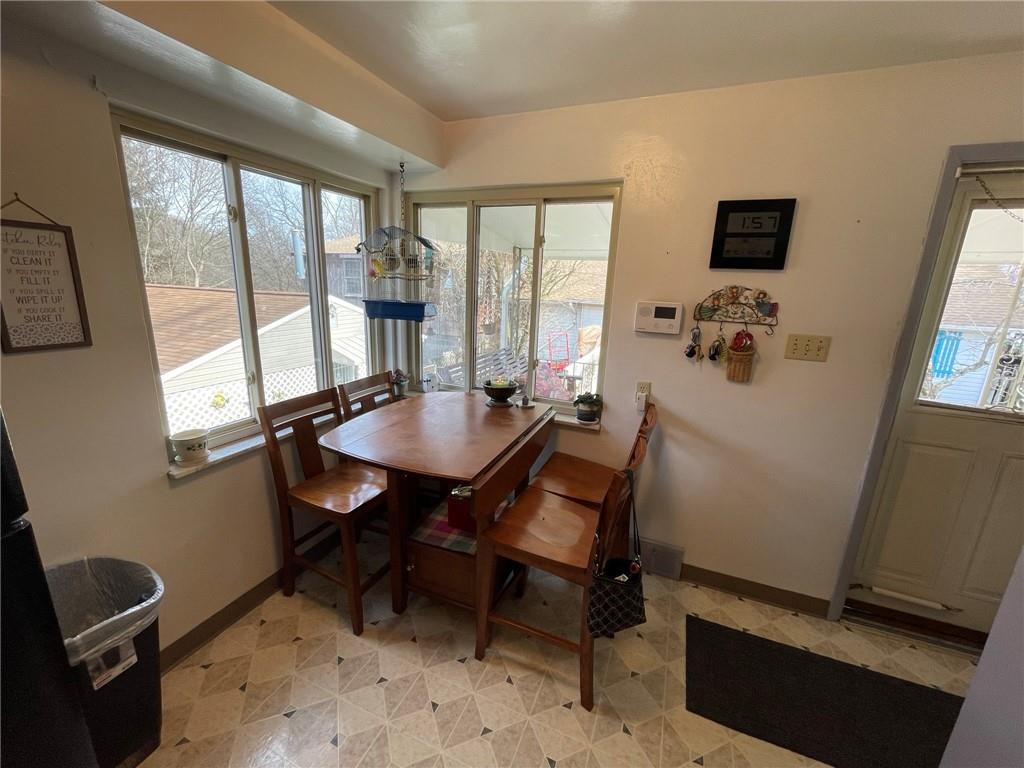 63 Locust Street McKees Rocks, PA 15136 - Photo 6 of 25 a view of a dining room with furniture and a window