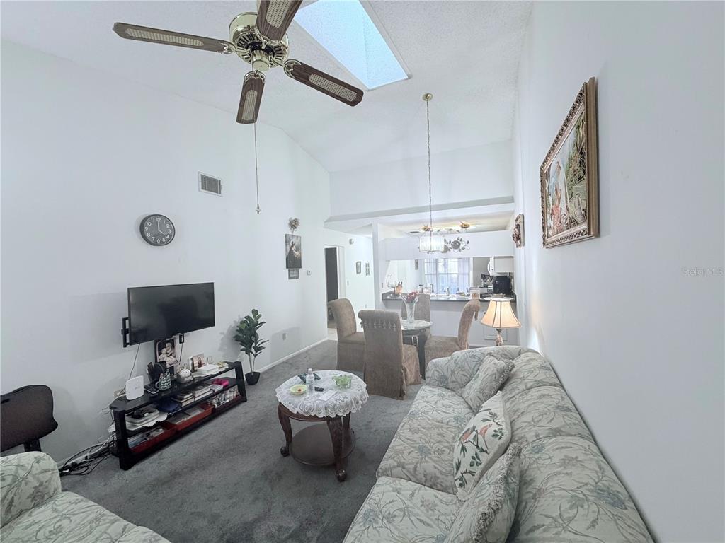 4523 Glen Hollow New Port Richey, FL 34653 - Photo 11 of 62 a living room with furniture and a flat screen tv