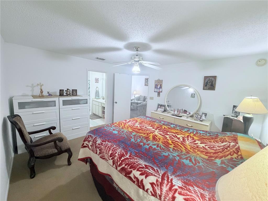 4523 Glen Hollow New Port Richey, FL 34653 - Photo 26 of 62 a bedroom with a bed and wooden floor