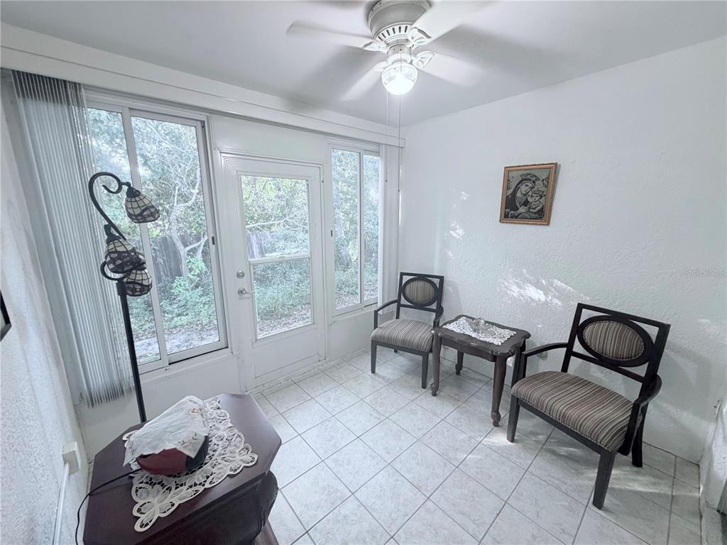4523 Glen Hollow New Port Richey, FL 34653 - Photo 45 of 62 a living room with furniture and a large window