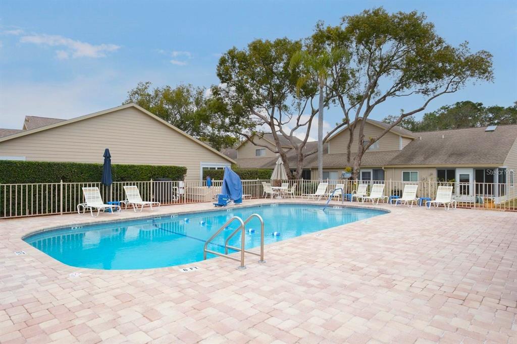 4523 Glen Hollow New Port Richey, FL 34653 - Photo 61 of 62 a view of a house with pool table and chairs