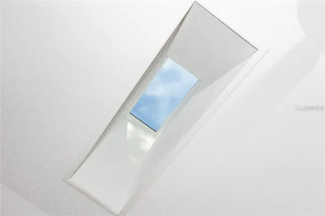 a view of walk in closet with clothes