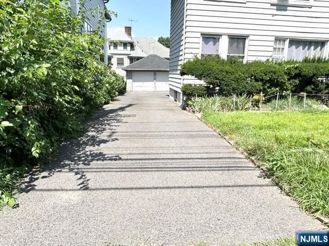 a view of a backyard of the house