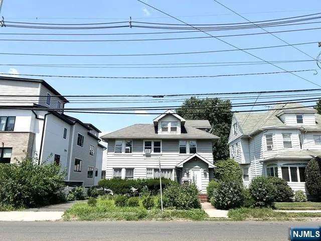 a front view of a building with garden