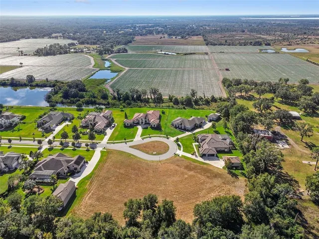an aerial view of a house with a ocean view