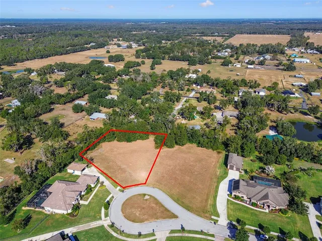an aerial view of a house with a outdoor space