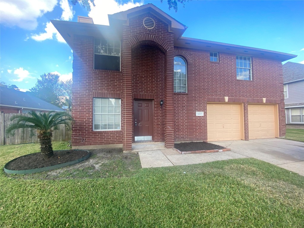 14007 Oleoke Lane Houston, TX 77015 - Photo 1 of 19 a front view of a house with a yard