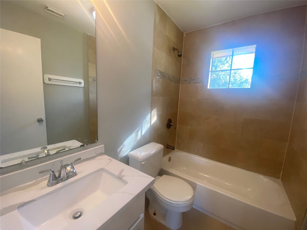 14007 Oleoke Lane Houston, TX 77015 - Photo 13 of 19 a bathroom with a sink mirror toilet and bathtub