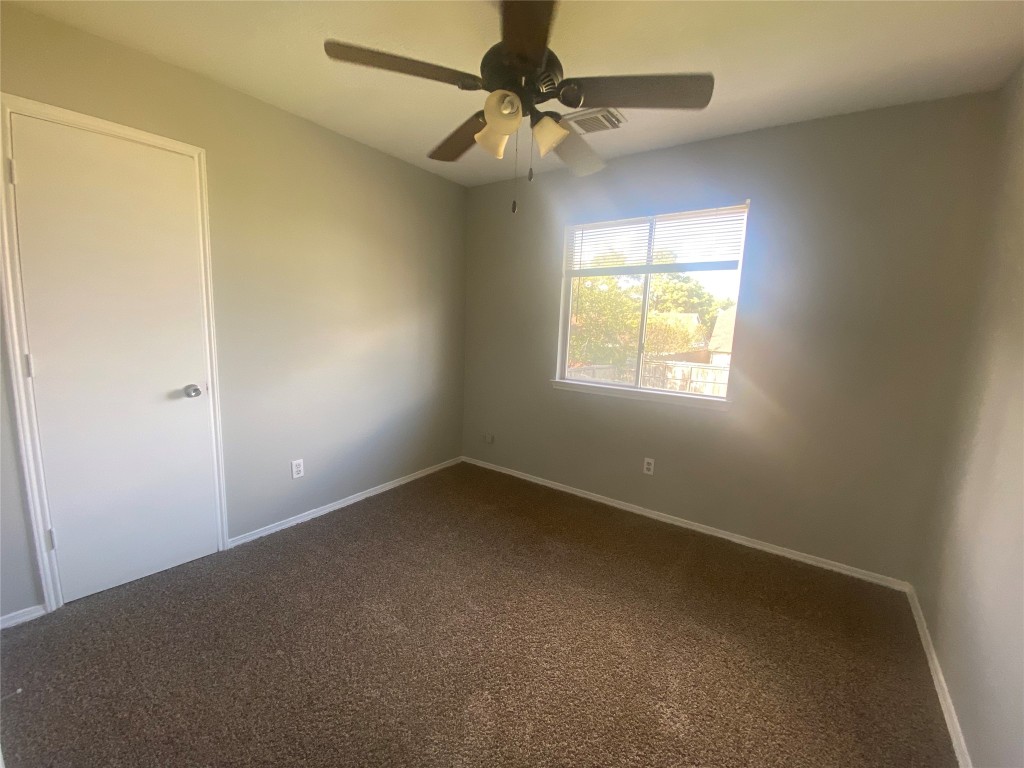 14007 Oleoke Lane Houston, TX 77015 - Photo 14 of 19 an empty room with a window and a fan