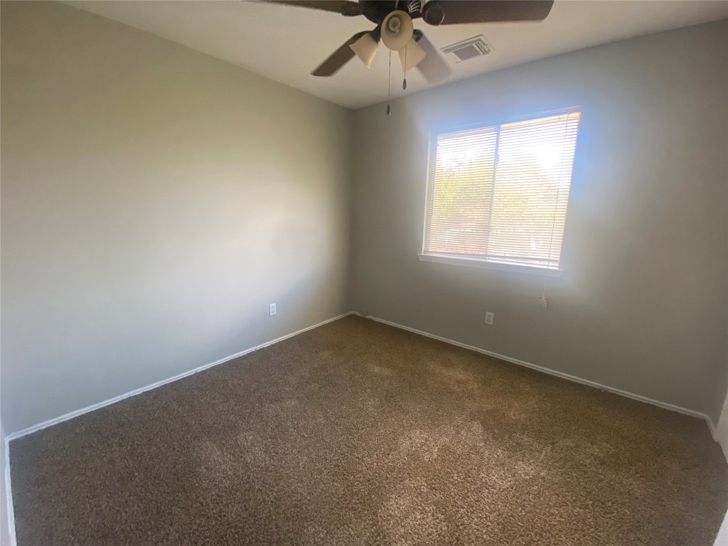 14007 Oleoke Lane Houston, TX 77015 - Photo 15 of 19 an empty room with a window and a fan