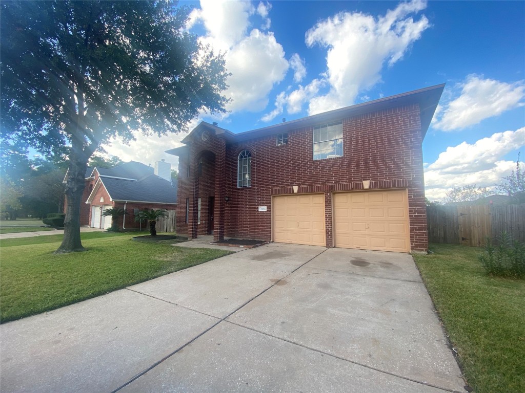14007 Oleoke Lane Houston, TX 77015 - Photo 2 of 19 a view of a house with a yard and garage