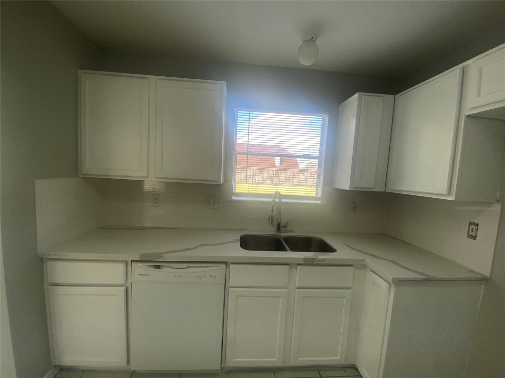 14007 Oleoke Lane Houston, TX 77015 - Photo 7 of 19 a kitchen with a sink cabinets and window