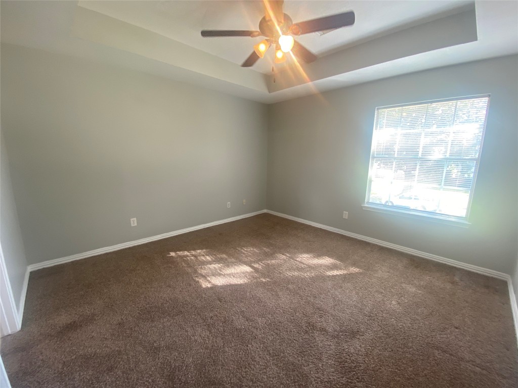 14007 Oleoke Lane Houston, TX 77015 - Photo 9 of 19 an empty room with a window and a fan