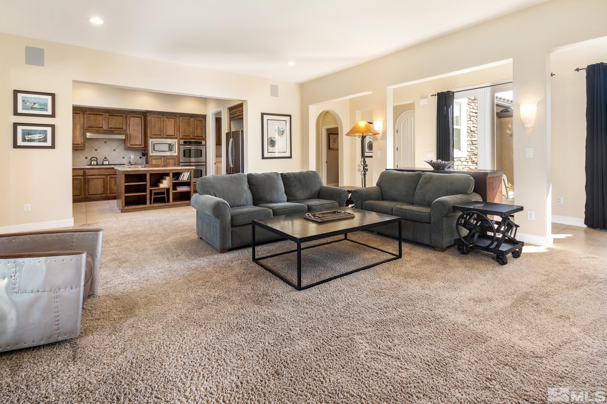 8573 Timaru Trail Reno, NV 89523 - Photo 12 of 40 a living room with furniture and a large window