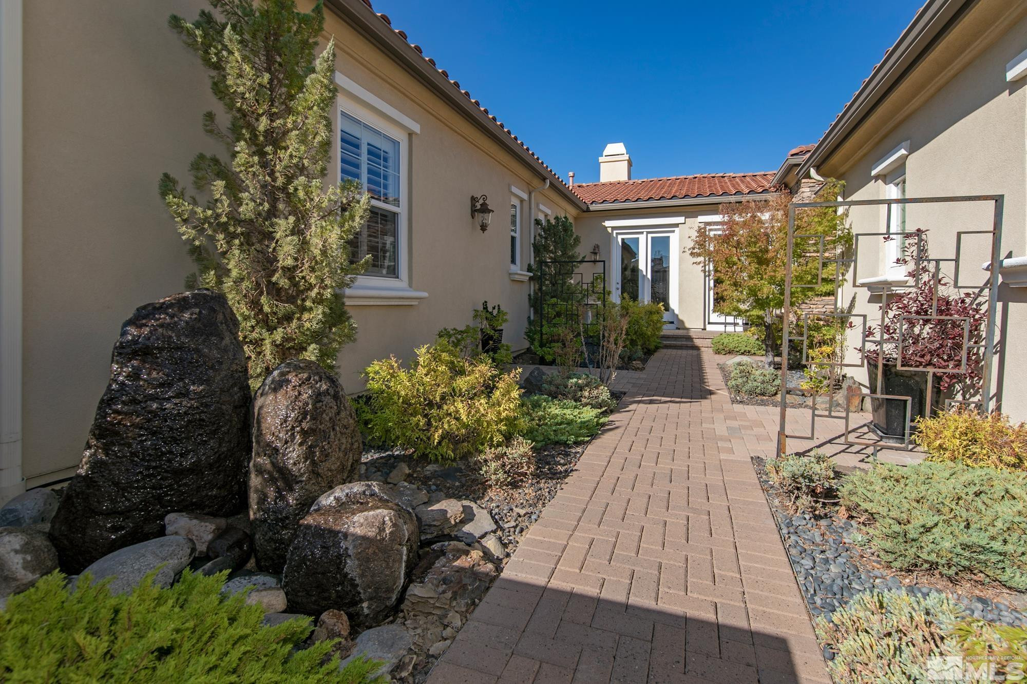 8573 Timaru Trail Reno, NV 89523 - Photo 3 of 40 a view of a house with a yard and sitting area