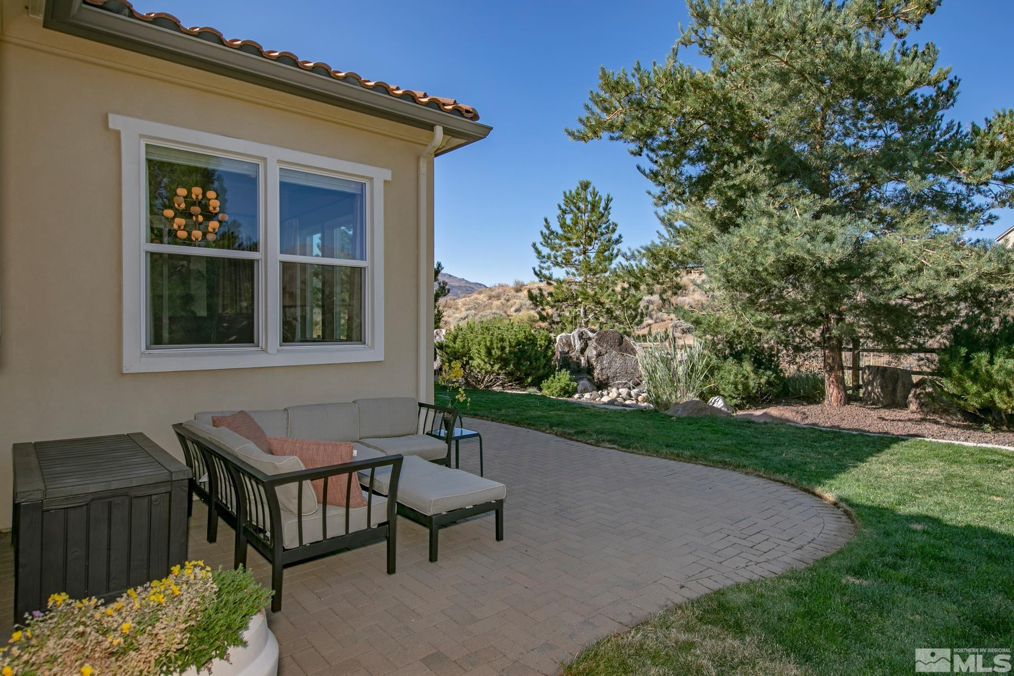 8573 Timaru Trail Reno, NV 89523 - Photo 32 of 40 a view of a house with backyard and sitting area