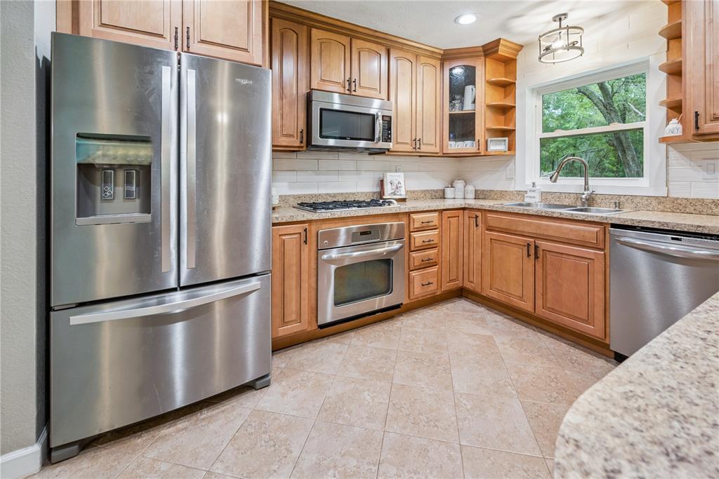 14545 Southwest 155th Avenue Brooker, FL 32622 - Photo 11 of 44 a kitchen with a refrigerator sink and microwave