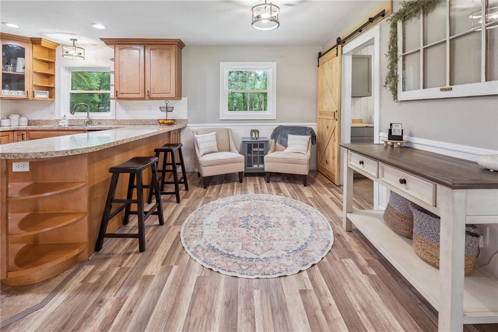 14545 Southwest 155th Avenue Brooker, FL 32622 - Photo 13 of 44 a living room with stainless steel appliances granite countertop furniture a fireplace a rug and a window