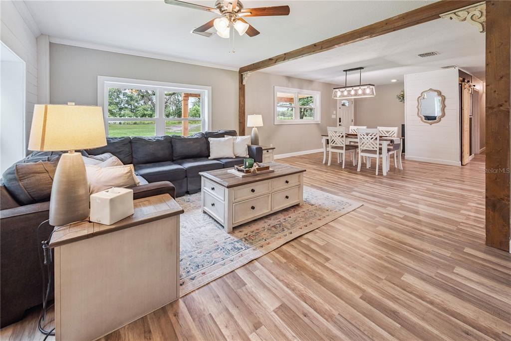 14545 Southwest 155th Avenue Brooker, FL 32622 - Photo 16 of 44 a living room with furniture and a large window