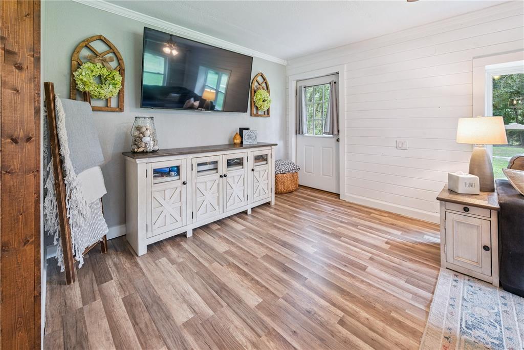 14545 Southwest 155th Avenue Brooker, FL 32622 - Photo 17 of 44 a view of a kitchen with cabinets and wooden floor