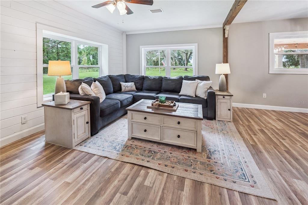 14545 Southwest 155th Avenue Brooker, FL 32622 - Photo 18 of 44 a living room with furniture and a large window