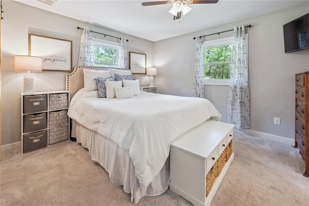 14545 Southwest 155th Avenue Brooker, FL 32622 - Photo 25 of 44 a bed room with a bed and a tv