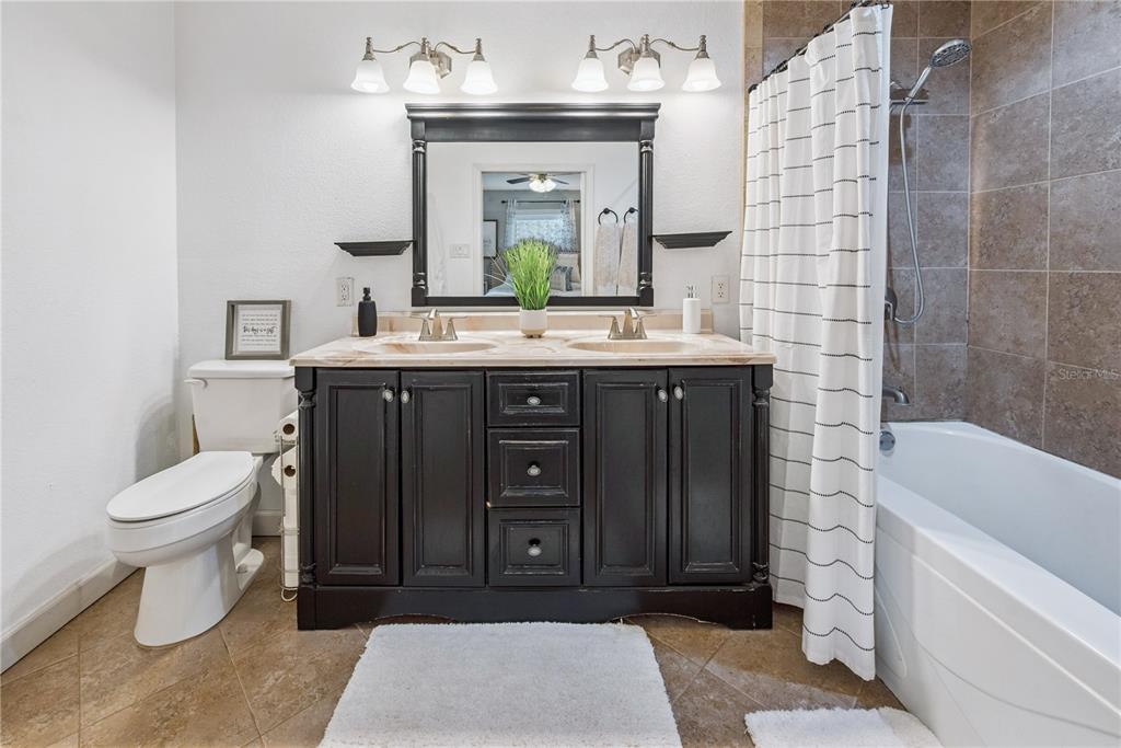 14545 Southwest 155th Avenue Brooker, FL 32622 - Photo 28 of 44 a bathroom with a sink and a mirror