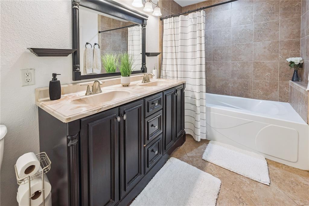 14545 Southwest 155th Avenue Brooker, FL 32622 - Photo 29 of 44 a bathroom with a sink a vanity and a mirror
