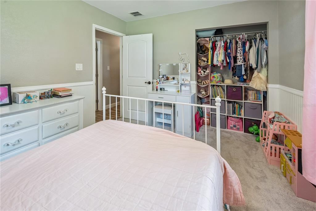 14545 Southwest 155th Avenue Brooker, FL 32622 - Photo 36 of 44 a bedroom with a bed and a book shelf