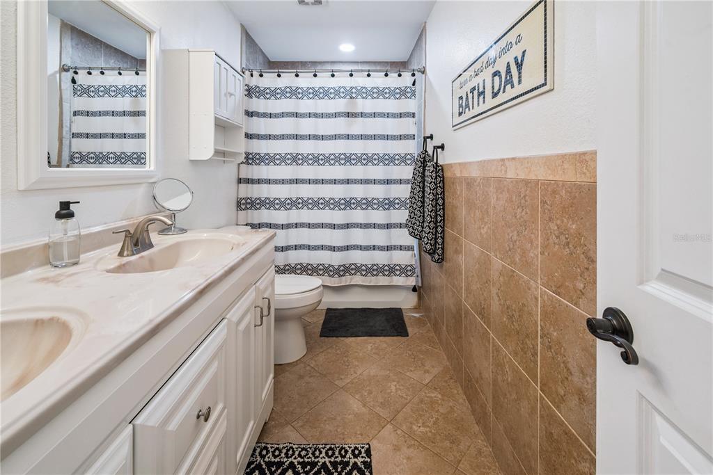 14545 Southwest 155th Avenue Brooker, FL 32622 - Photo 38 of 44 a bathroom with a sink a toilet and shower