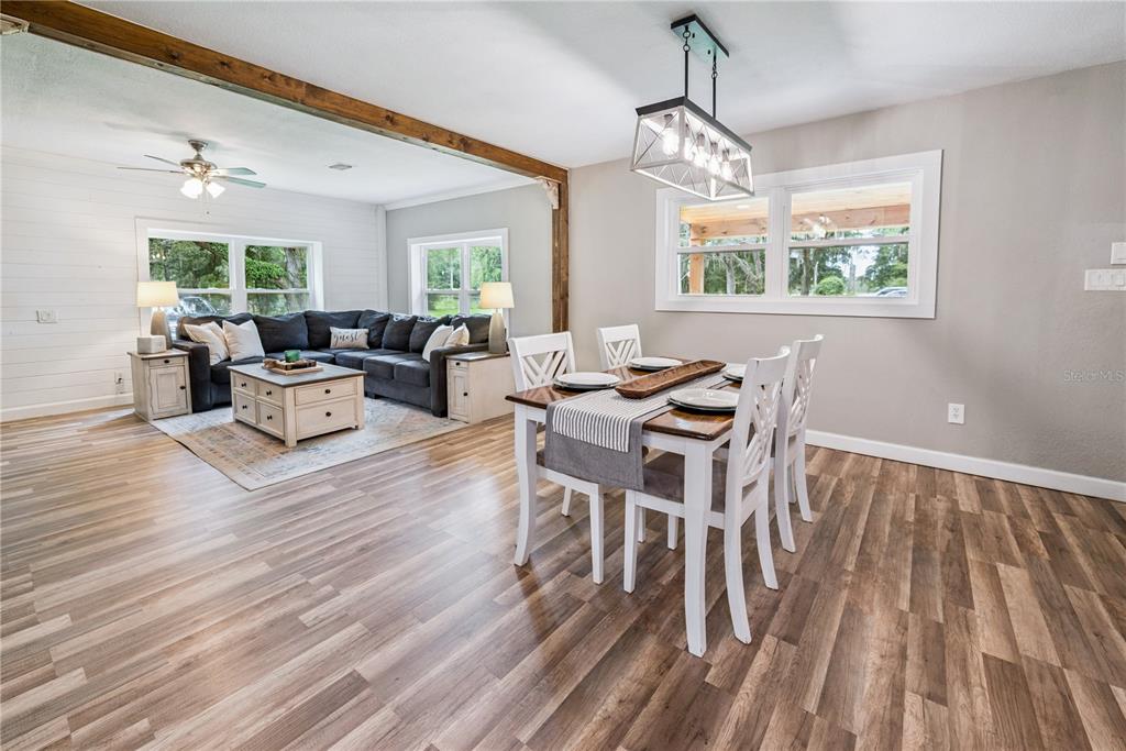 14545 Southwest 155th Avenue Brooker, FL 32622 - Photo 5 of 44 a living room with furniture a window and wooden floor