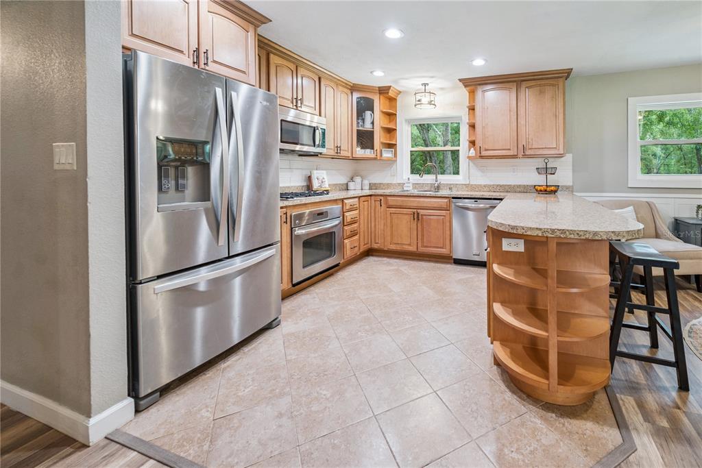 14545 Southwest 155th Avenue Brooker, FL 32622 - Photo 9 of 44 a kitchen with stainless steel appliances a refrigerator sink and cabinets