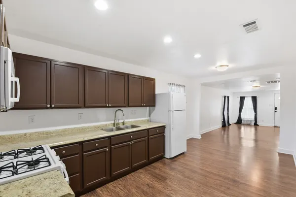 a kitchen with a sink and cabinets
