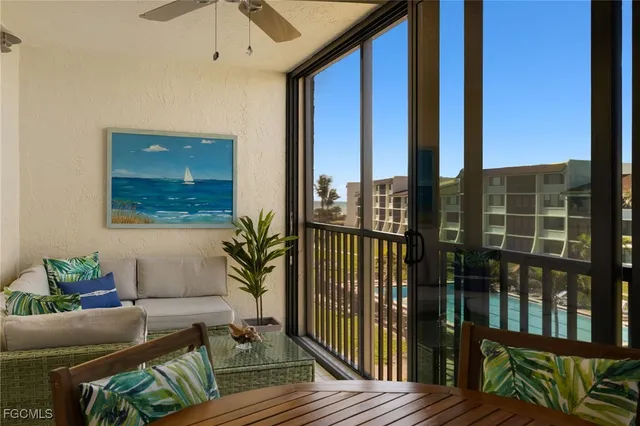 a room with furniture and a potted plant