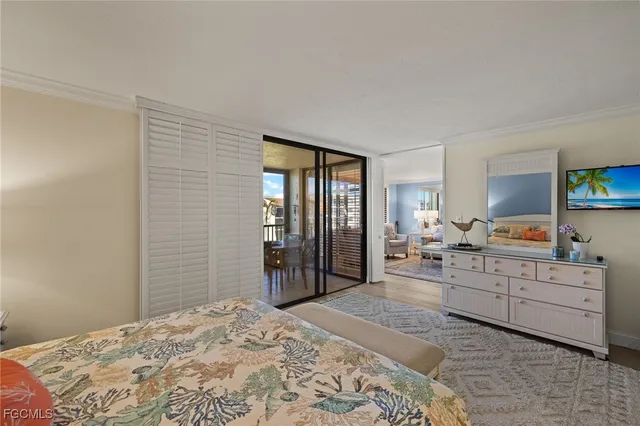 a bedroom with a bed and a table in it