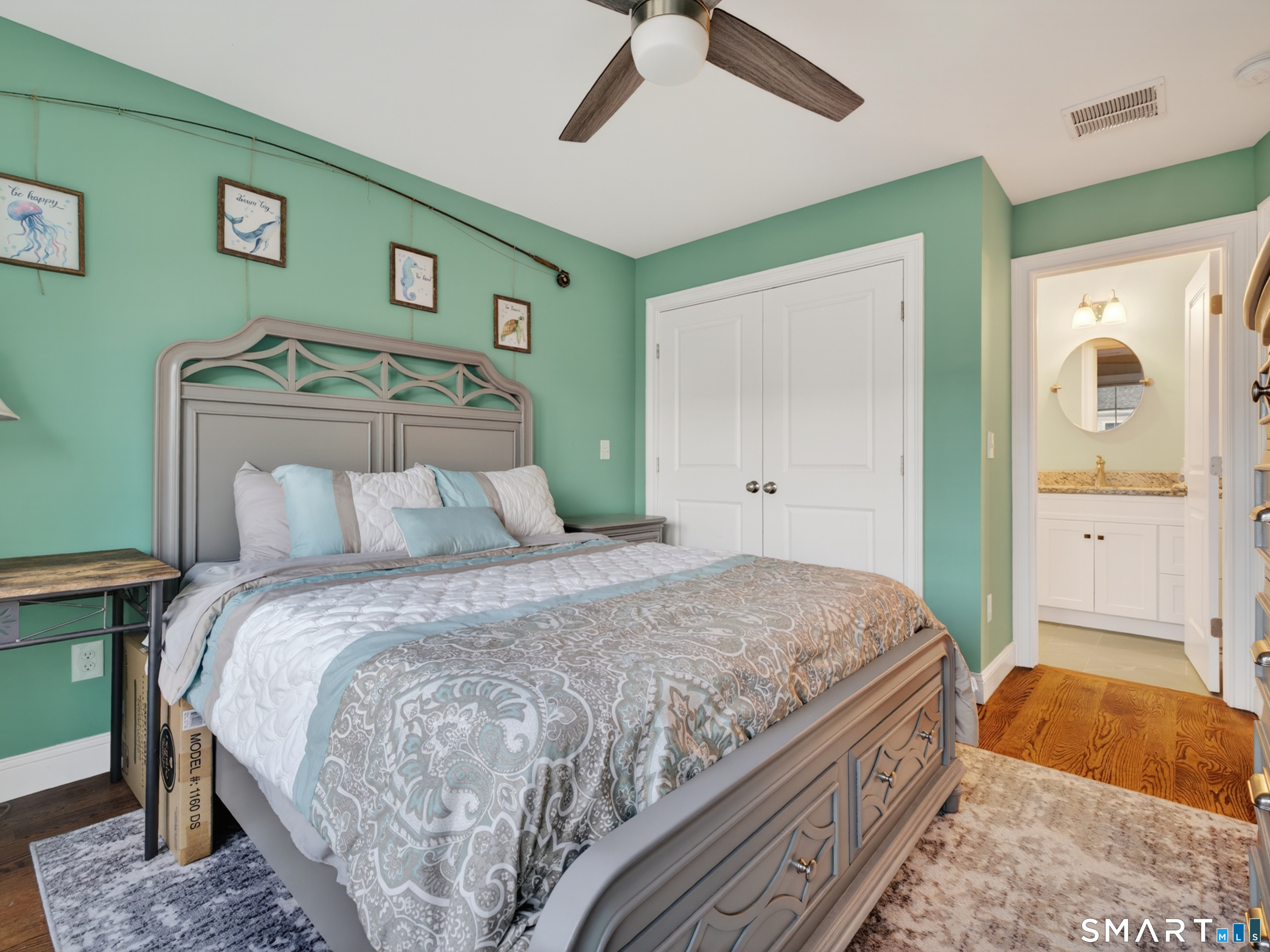 34 Village Crossing, Unit 34 Niantic, CT 06357 - Photo 28 of 38 a bedroom with a bed and a painting on the wall